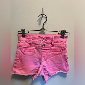 Justice, girls youth pink jean shorts with snap buttons.